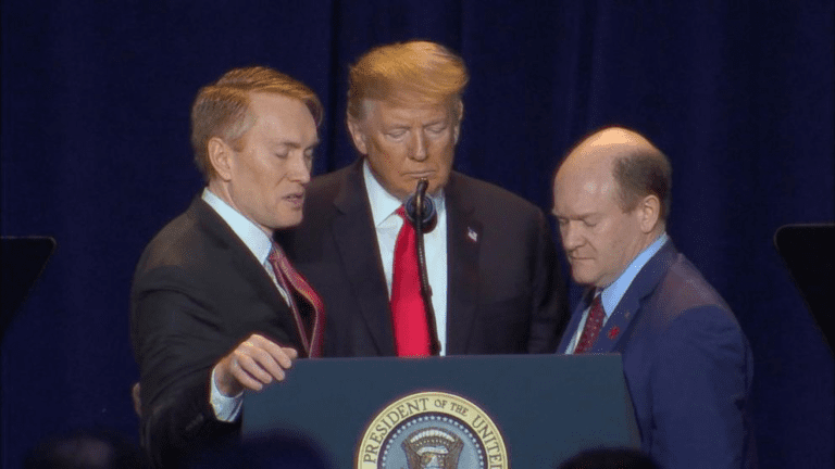 Trump & co-chairs praying